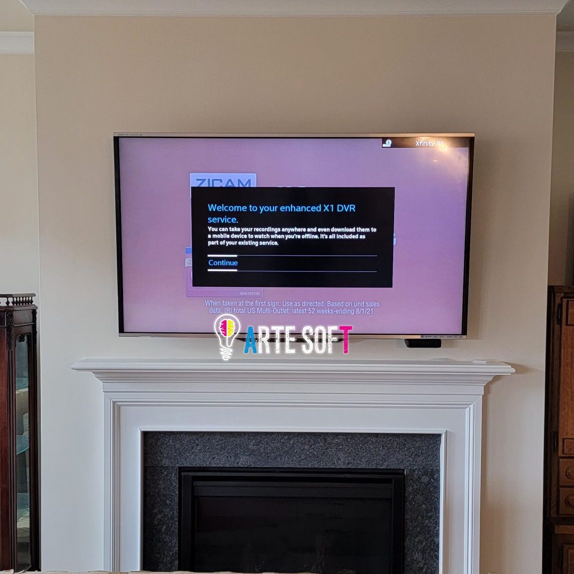 TV wall mount installation with wire concealment over fireplace