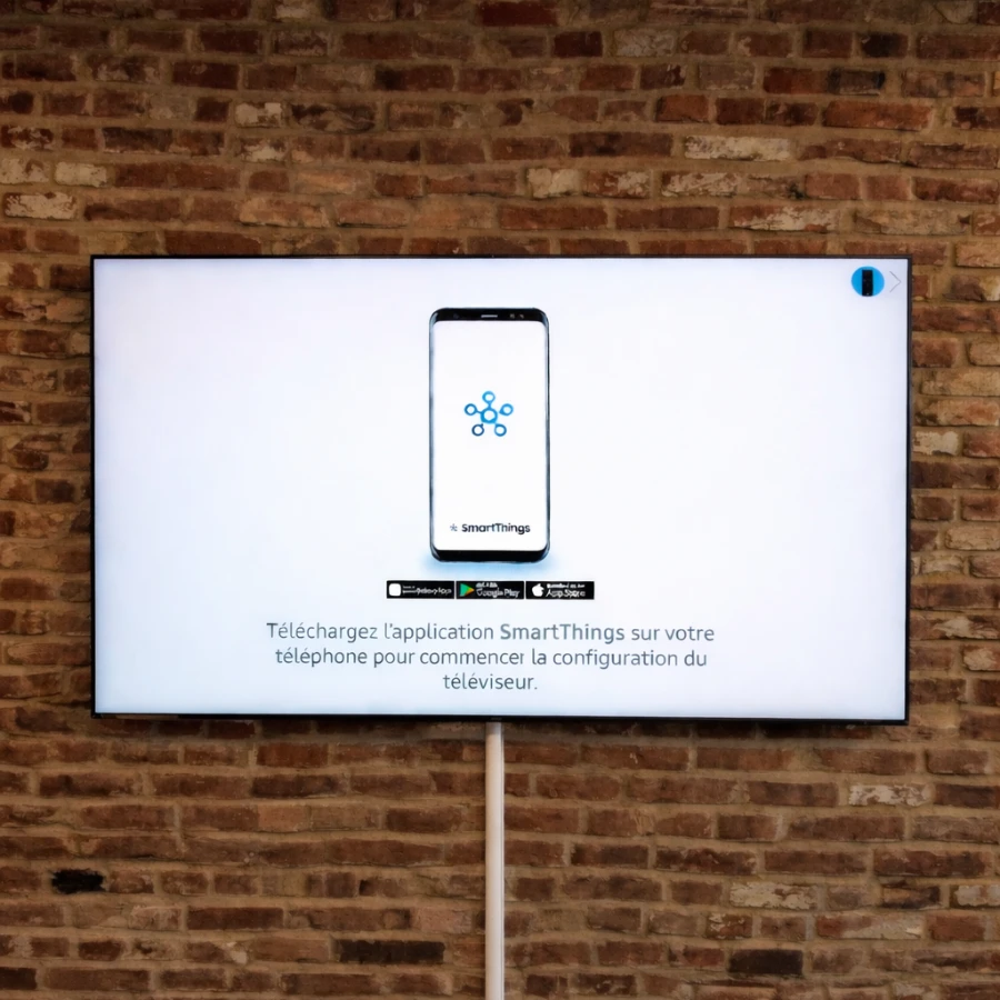 TV mounting installation on a brick wall