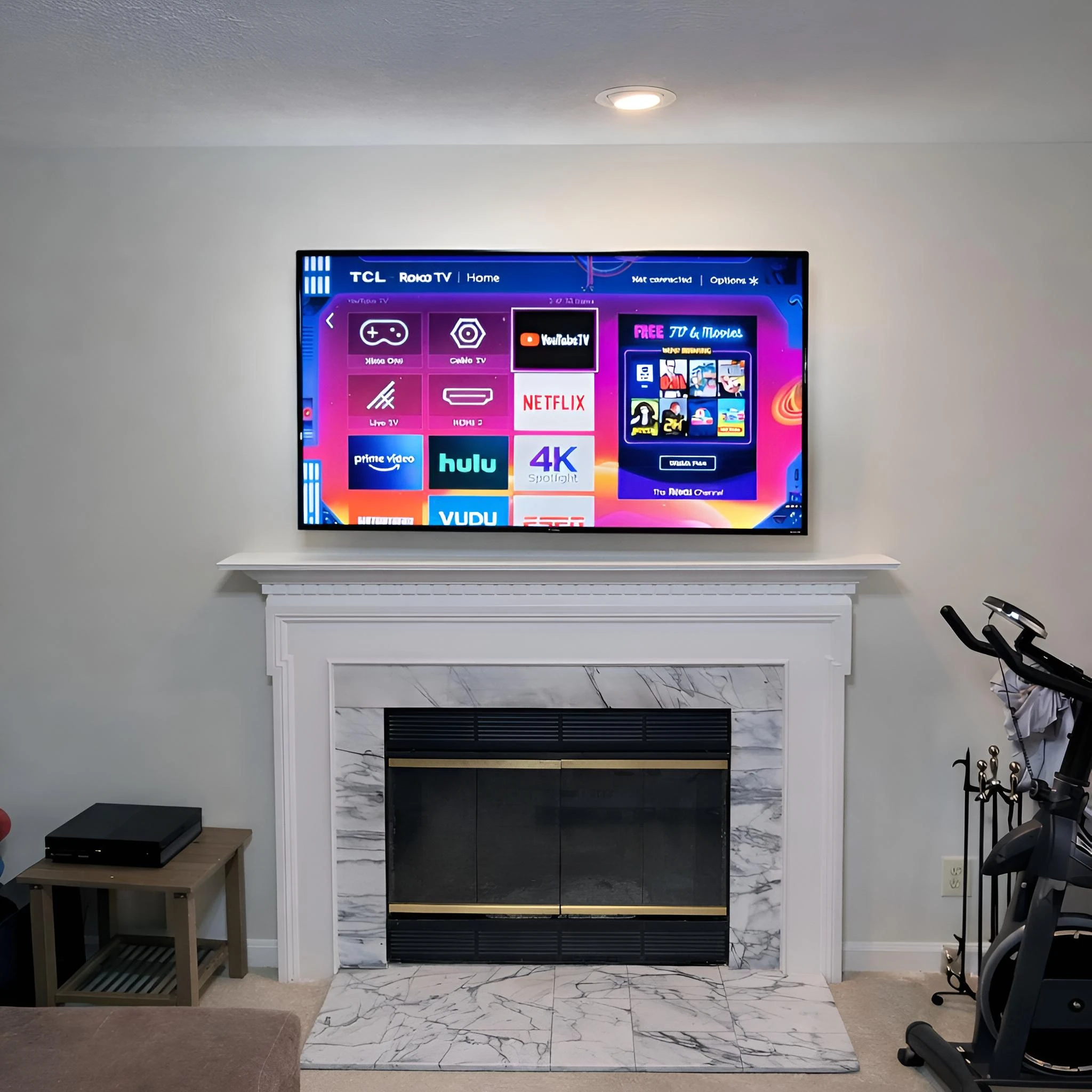 Above-fireplace TV mounting installation in Woodbridge VA with a level TV over the mantel
