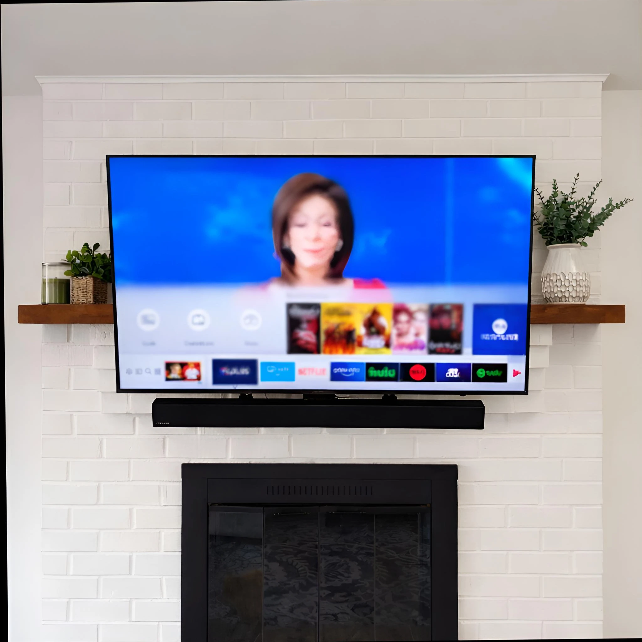 Pull-down TV mount on brick fireplace in Centreville Virginia