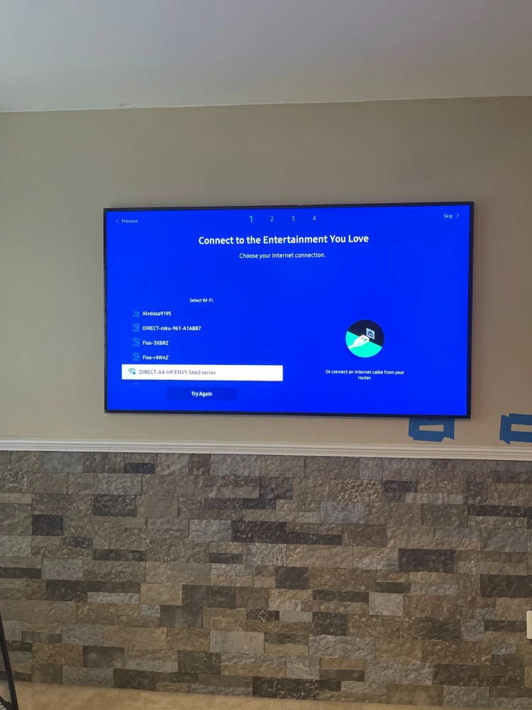 Samsung Frame TV mounted on the wall after installation and setup