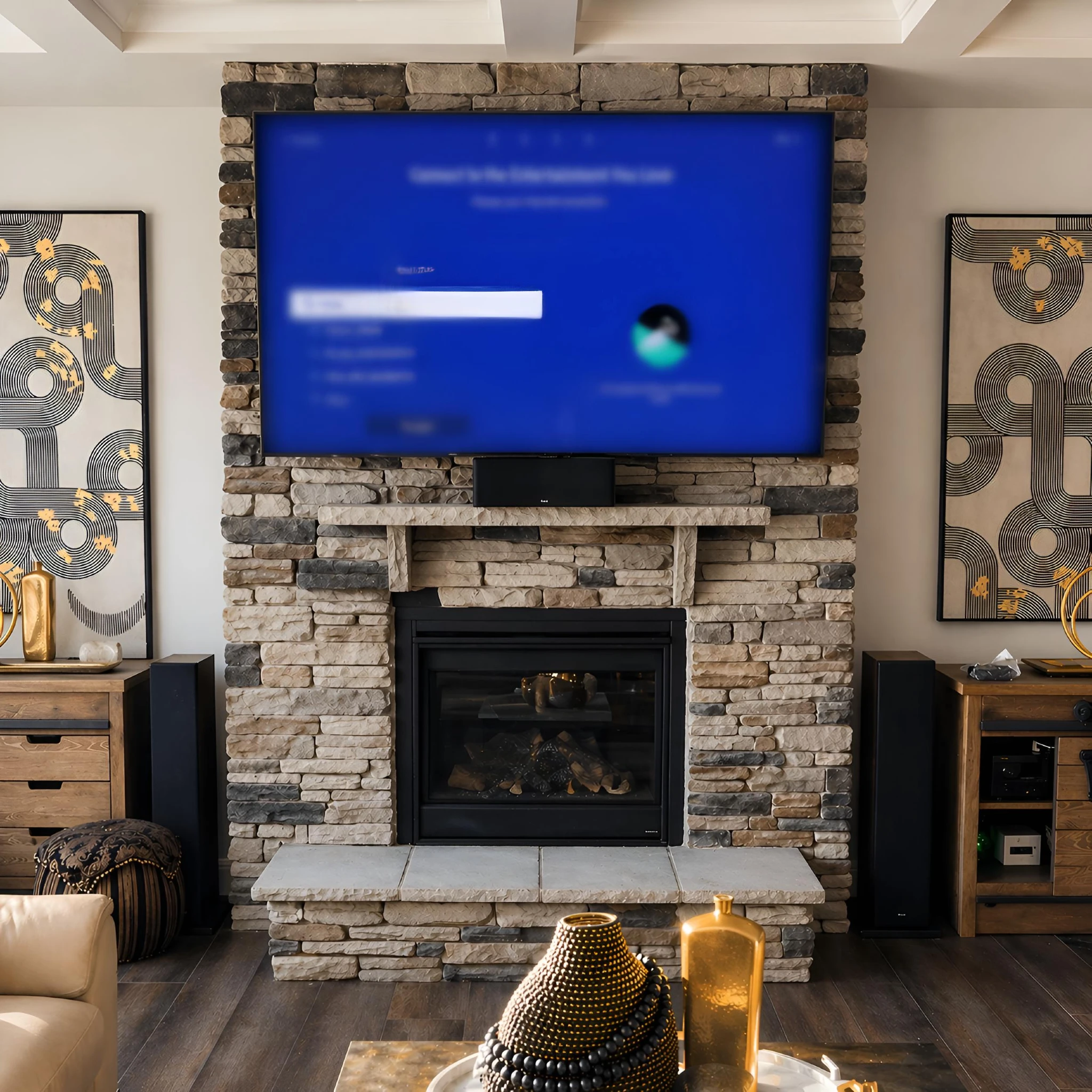 Samsung Frame TV installation on a stone fireplace wall